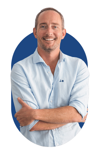 Sam Lister - Tailormade Andalucia Happy man wearing blue shirt with arms crossed