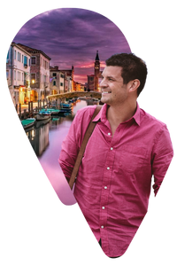 travel-designer-in-Italy Man wearing pink shirt looking at a image of Venice Italy