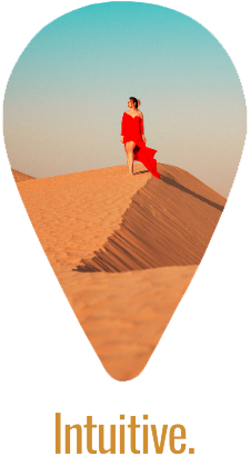 woman-walking-down-sand-dune Woman in red dress walking down a sand dune with the world 'intuitive' typed below