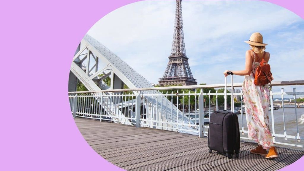 Female traveller walks through Paris
