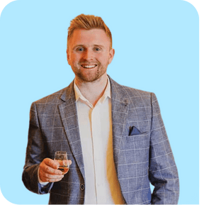 Professional travel designer wearing a suit looking happy